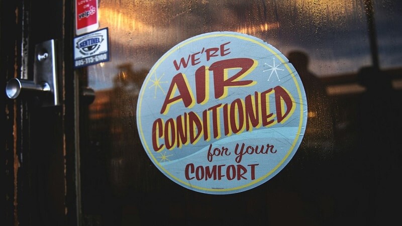 ‘We’re air-conditioned’ sticker on the café door